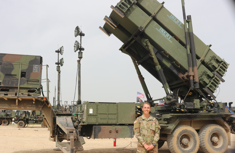Second Lt. Jennifer Slade stands in front of an Air Defense Delta Battery (photo credit: ANNA AHRONHEIM)