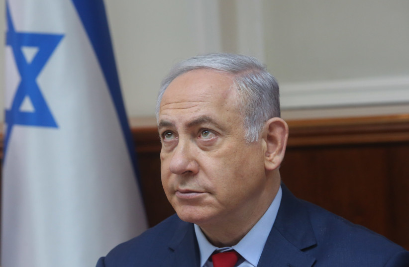 Prime Minister Benjamin Netanyahu at a cabinet meeting, March 11, 2018 (photo credit: MARC ISRAEL SELLEM/THE JERUSALEM POST)