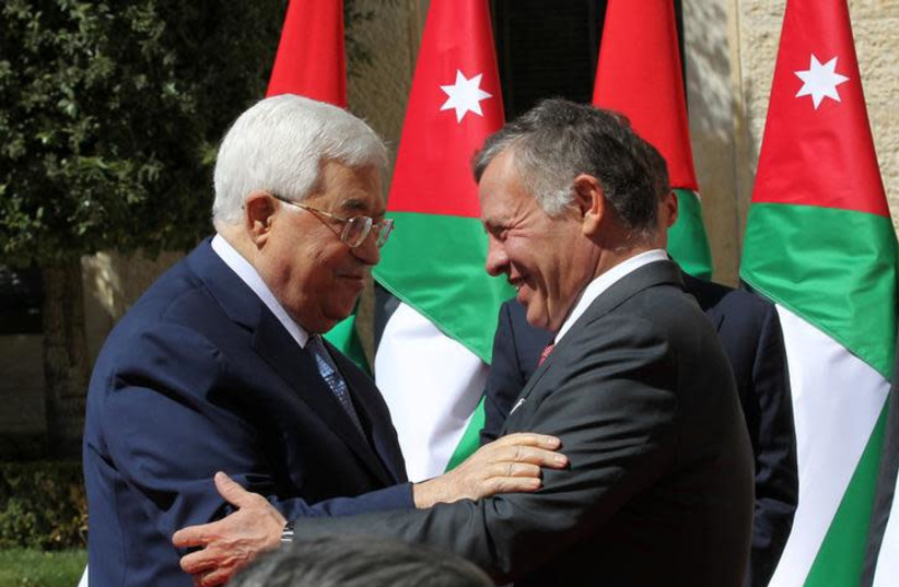 Jordan's King Abdullah meets Palestinian president Mahmoud Abbas at the Royal Palace in Amman, Jordan March 12, 2018.  (photo credit: REUTERS/MOHAMMAD ABU GHOSH/POOL)