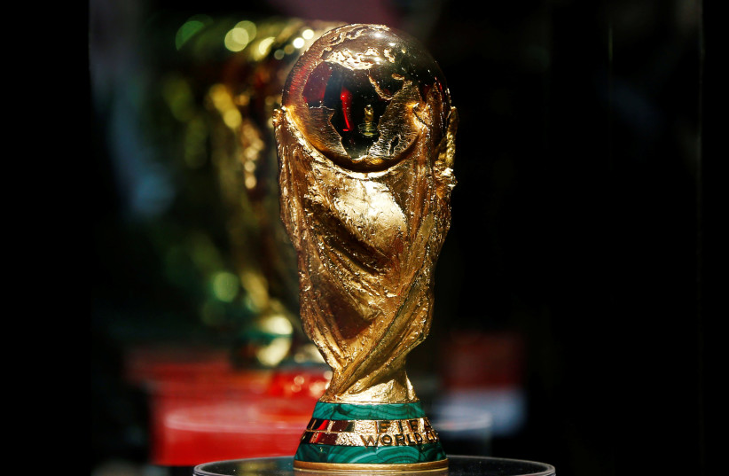 The FIFA world cup trophy is displayed during the Fifa World Cup Trophy Tour, in Amman, Jordan February 20, 2018.  (photo credit: REUTERS/MUHAMMAD HAMED)