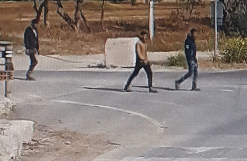 Three armed Palestinians who infiltrated Israel from Gaza caught on security camera footage lurking around Kibbutz Ze'elim (photo credit: ESHKOL REGIONAL COUNCIL)