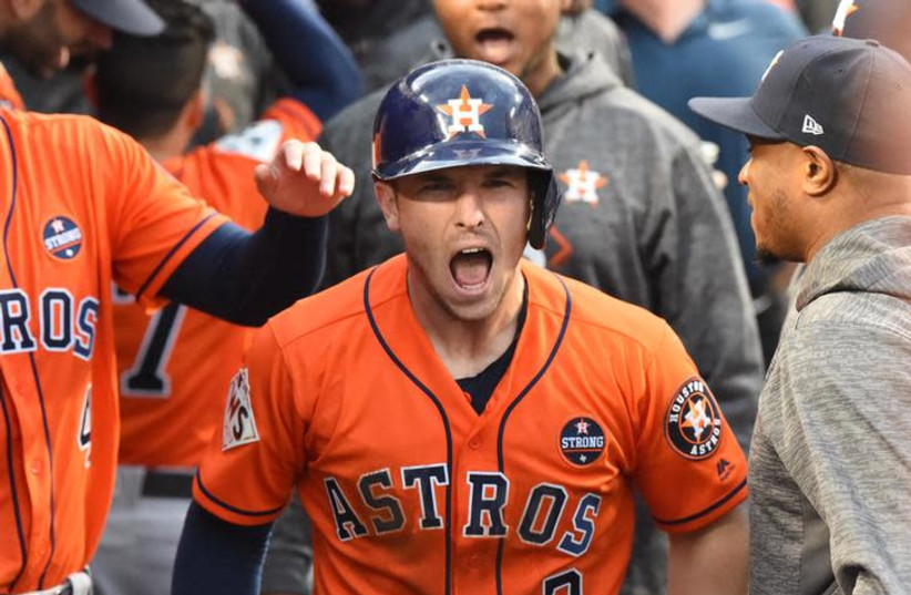 Houston Astros third baseman Alex Bregman (2) reacts after scoring a run against the Los Angeles Dodgers in the first inning in game seven of the 2017 World Series at Dodger Stadium. (photo credit: JAYNE KAMIN-ONCEA-USA TODAY SPORTS/REUTERS)
