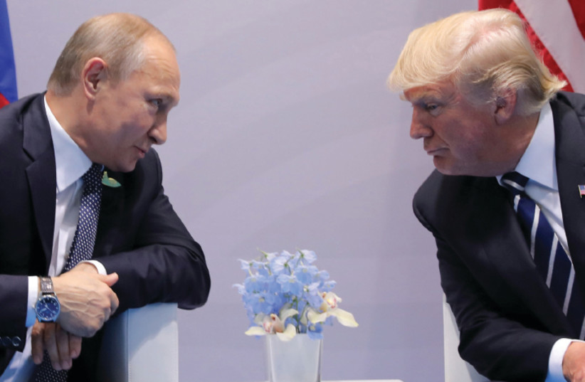 Russia’s President Vladimir Putin faces off with US President Donald Trump at the G20 summit in Hamburg on July 7, 2017 (photo credit: CARLOS BARRIA / REUTERS)