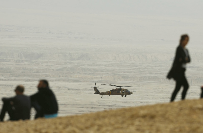 A HELICOPTER searches for hikers who died in a flash flood. (photo credit: REUTERS)