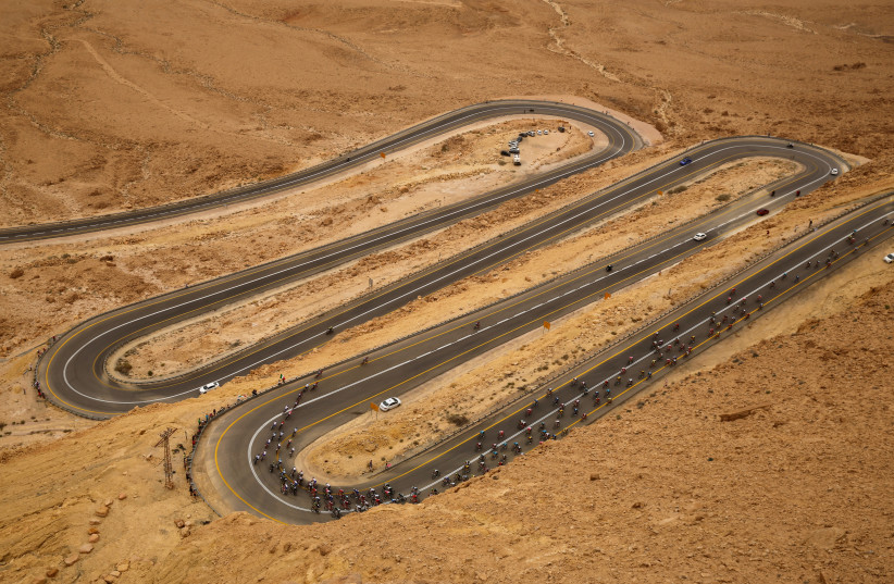 Riders compete on a main road near Mitzpe Ramon during stage 3 of the 101st Giro d'Italia cycling race from Beersheba to Eilat, Israel, May 6, 2018 (photo credit: REUTERS/AMIR COHEN)