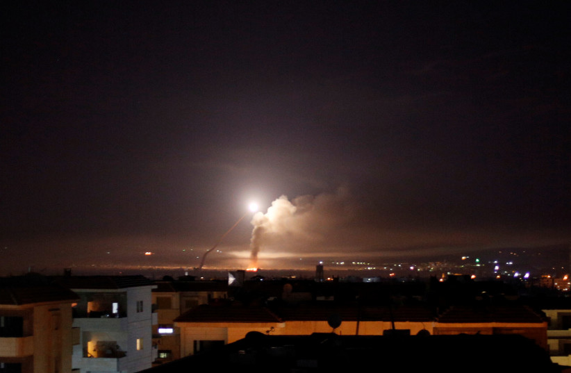 Missile fire is seen from Damascus, Syria May 10, 2018 (photo credit: REUTERS/OMAR SANADIKI)