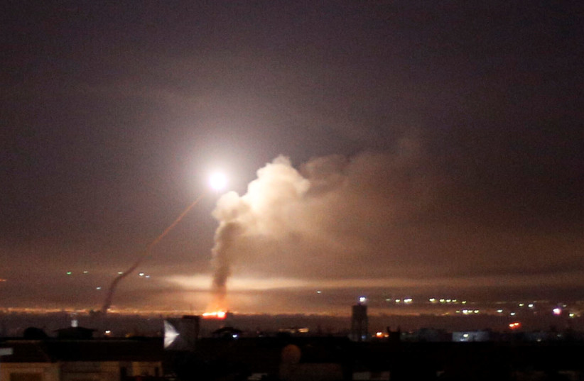Missile fire is seen from Damascus, Syria (photo credit: OMAR SANADIKI/REUTERS)