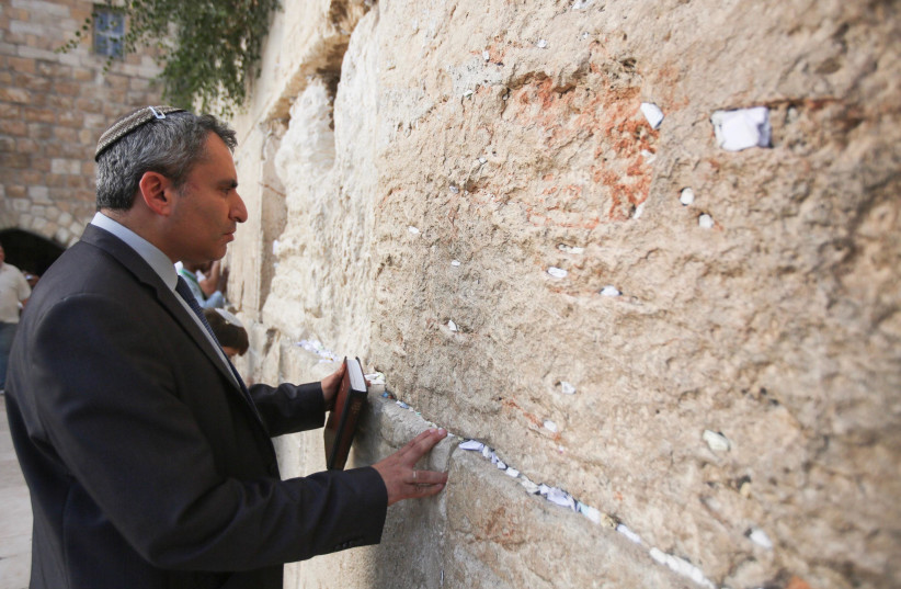 JERUSALEM AFFAIRS Minister Ze’ev Elkin prays at the Western Wall yesterday (photo credit: MARC ISRAEL SELLEM/THE JERUSALEM POST)