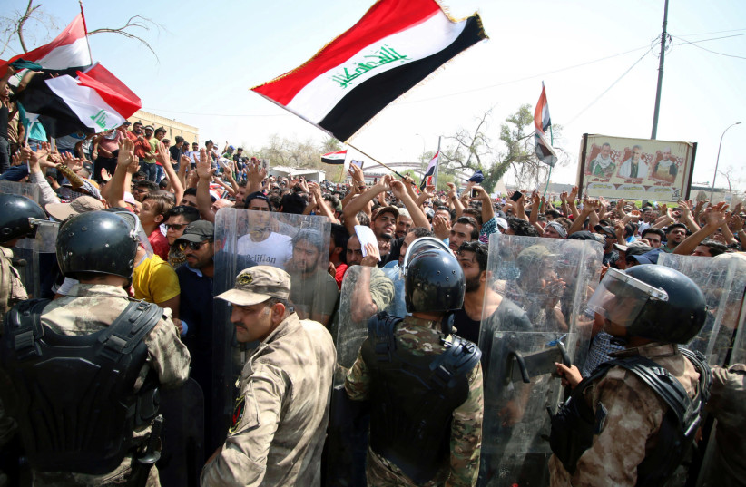Protesters gather near the main provincial government building in Basra, Iraq July 15, 2018. (photo credit: ESSAM AL-SUDANI/ REUTERS)