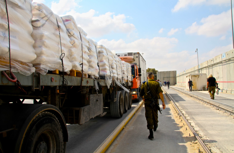Humanitarian goods are transfered via the Kerem HaShalom crossing from Israel into Gaza. (photo credit: TOVAH LAZAROFF)