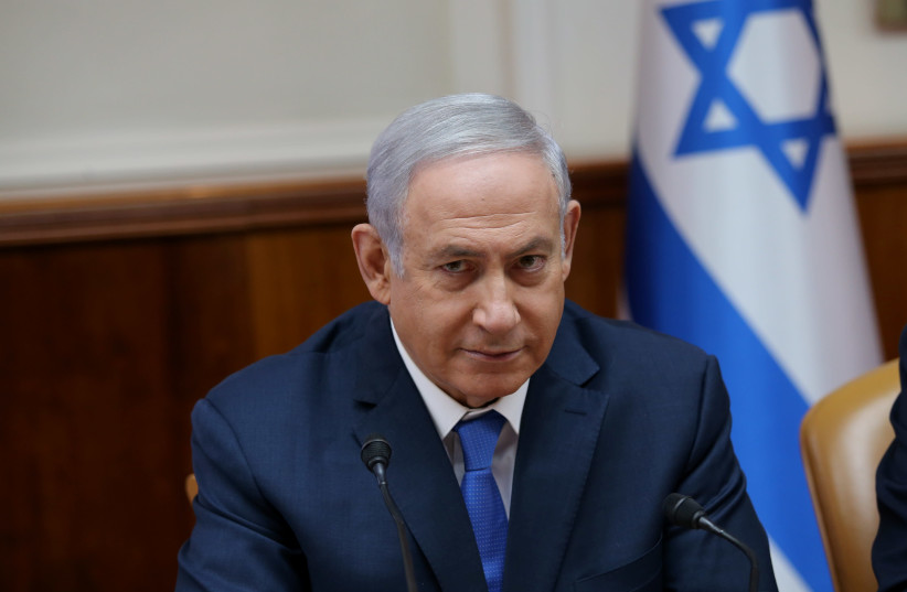 Prime Minister Benjamin Netanyahu at the cabinet meeting July 29, 2018 (photo credit: ALEX KOLOMOISKY / POOL)