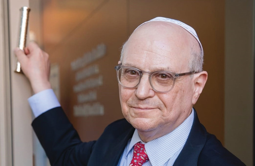 DR. LARRY NORTON affixes a mezuzah Tuesday at the new Negev cancer center established in his name.  (photo credit: RACHEL DAVID)