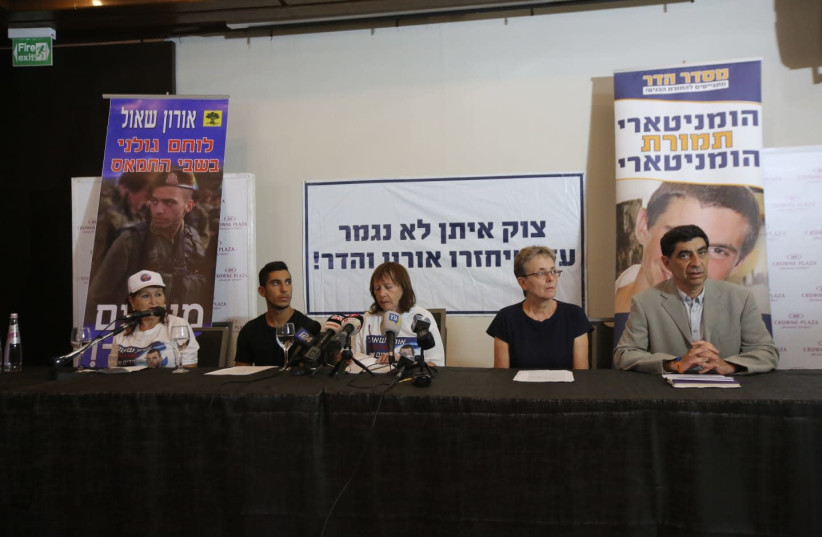 The families of Hadar Goldin and Oron Shaul at a press conference, August 5, 2018 (photo credit: MARC ISRAEL SELLEM/THE JERUSALEM POST)