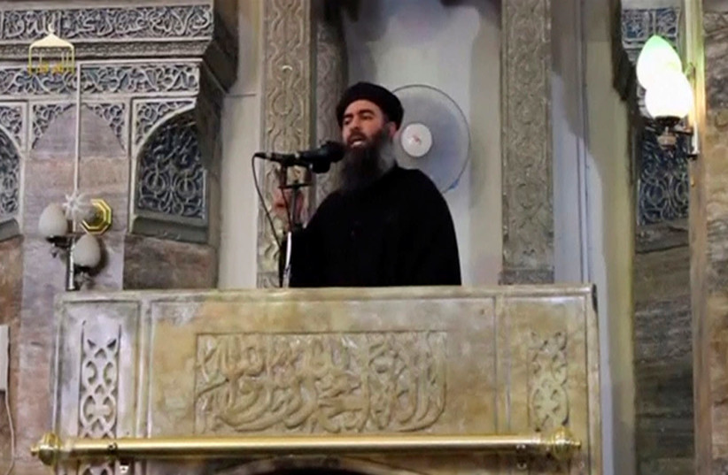A man purported to be the reclusive leader of the militant Islamic State Abu Bakr al-Baghdadi has made what would be his first public appearance at a mosque in the centre of Iraq's second city, Mosul, according to a video recording posted on the Internet on July 5, 2014, in this still image taken fr (photo credit: REUTERS FILE PHOTOS)