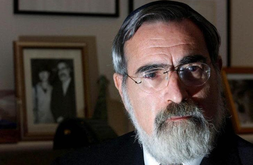 Britain's Chief Rabbi Dr Jonathan Sacks speaks during an interview at his home in London, April 17, 2002 (photo credit: REUTERS)