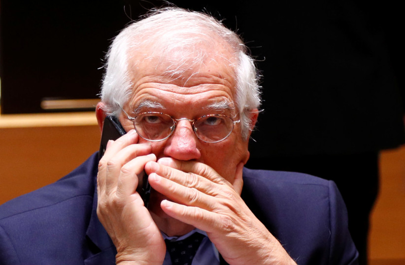 Spain's Foreign Minister Josep Borrell speaks on his mobile phone at the start of a European Union foreign ministers meeting in Brussels, Belgium July 16, 2018 (photo credit: REUTERS/FRANCOIS LENOIR)