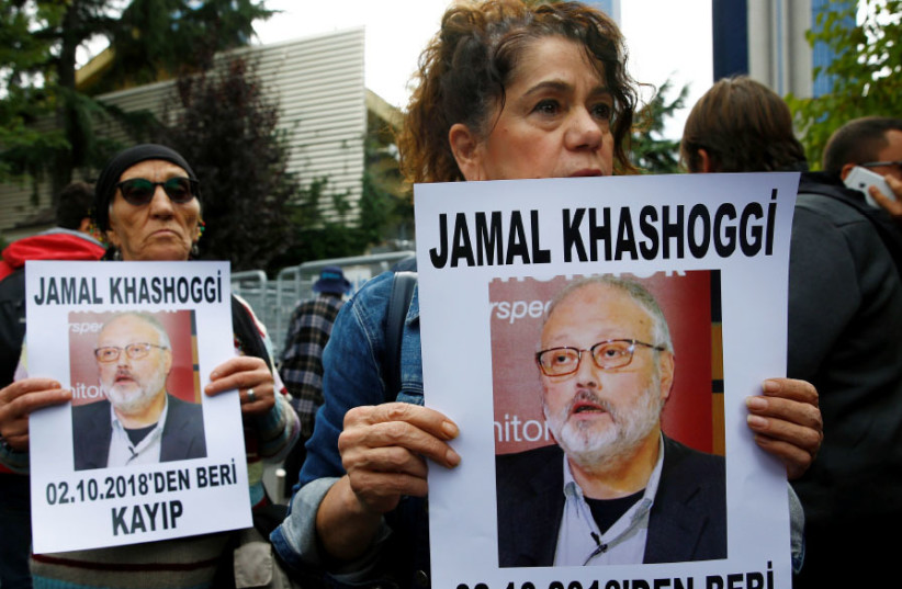 HUMAN RIGHTS activists hold pictures of Saudi journalist Jamal Khashoggi during a protest outside the Saudi Consulate in Istanbul on October 9. (photo credit: REUTERS)