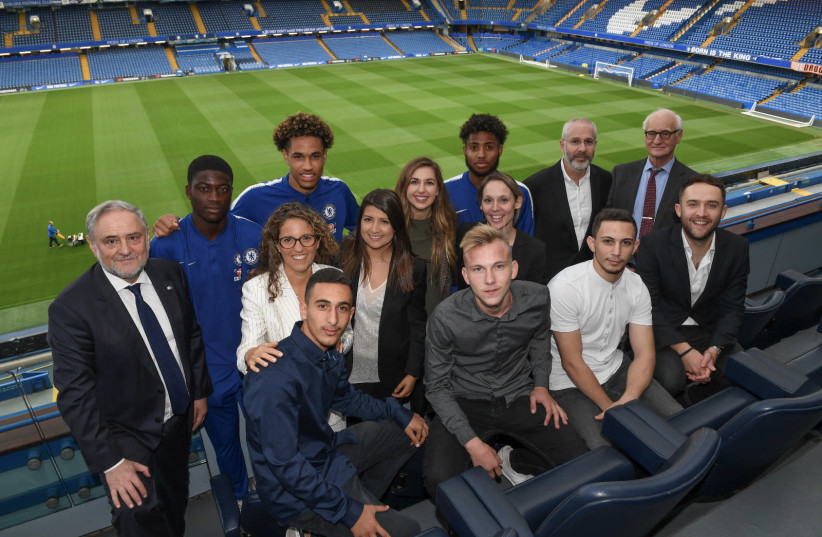 Members of the Chelsea Academy, Chelsea Football Club, the WJC and the winners of Pitch for Hope, Stamford Bridge, 2018 (photo credit: SHAHAR AZRAN / WJC)