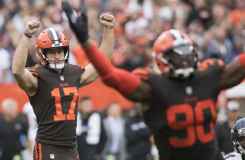 Cleveland Browns kicker Greg Joseph (17) and defensive end Emmanuel Ogbah (90) celebrate after Joseph kicked the game winning field goal in overtime against the Baltimore Ravens (photo credit: KEN BLAZE-USA TODAY SPORTS VIA REUTERS)