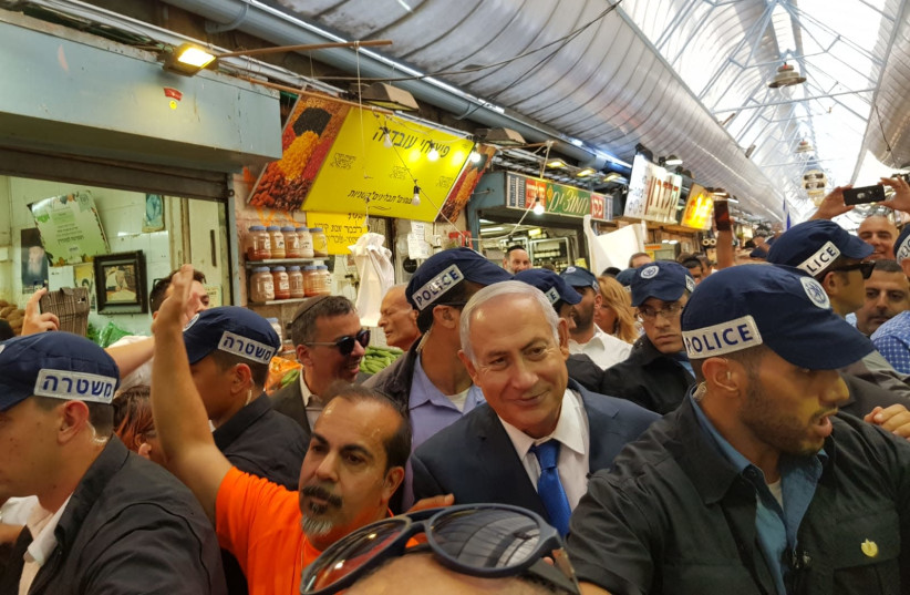 Prime Minister Benjamin Netanyahu visits the shuk in Jerusalem to campaign for municipal elections (photo credit: Courtesy)