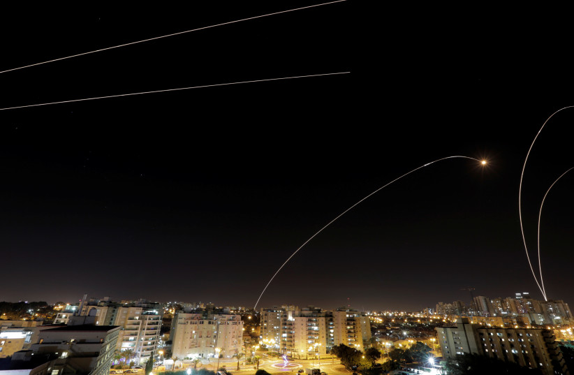 A general view of the Israeli city of Ashkelon, as an Iron Dome anti-missile fires near the Israeli side of the Israel-Gaza border, November 12, 2018 (photo credit: AMIR COHEN - REUTERS)