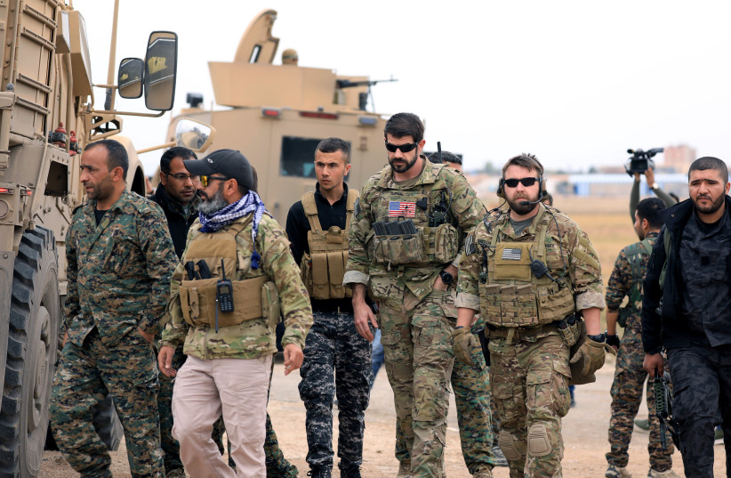 Syrian Democratic Forces and U.S. troops are seen during a patrol near Turkish border in Hasakah, Syria November 4, 2018 (photo credit: REUTERS/RODI SAID)