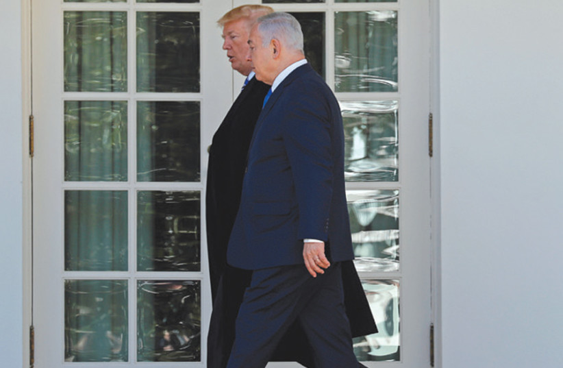 US President Donald Trump and Prime Minister Benjamin Netanyahu walk to the Oval Office on March 5, 2018 (photo credit: KEVIN LAMARQUE/REUTERS)