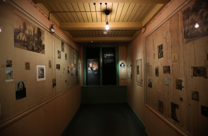 Photos are seen inside the Anne Frank House museum in Amsterdam, Netherlands, November 21, 2018.  (photo credit: REUTERS/EVA PLEVIER)
