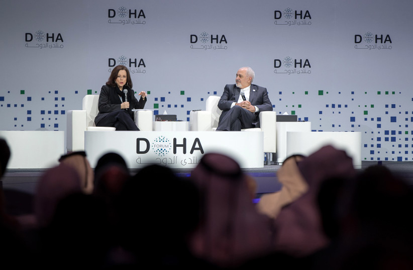 US journalist Robin Wright (L) speaks while seated with Iran's Foreign Minister Mohammad Javad Zarif, during a session of the Doha Forum in the Qatari capital on December 15, 2018. (photo credit: AFP PHOTO)