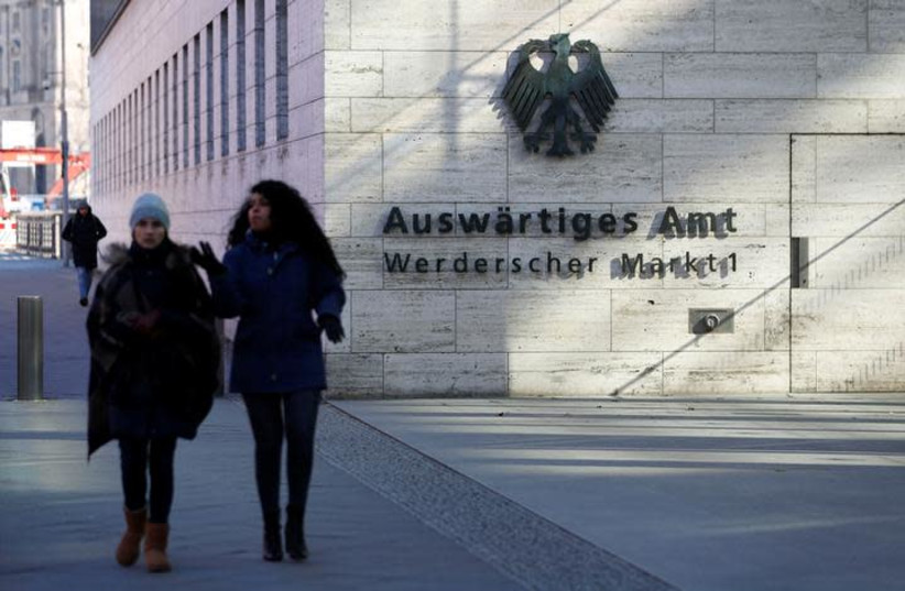 People walk past the seat of the German Foreign Ministry in Berlin, Germany, March 1, 2018. (photo credit: REUTERS/FABRIZIO BENSCH)