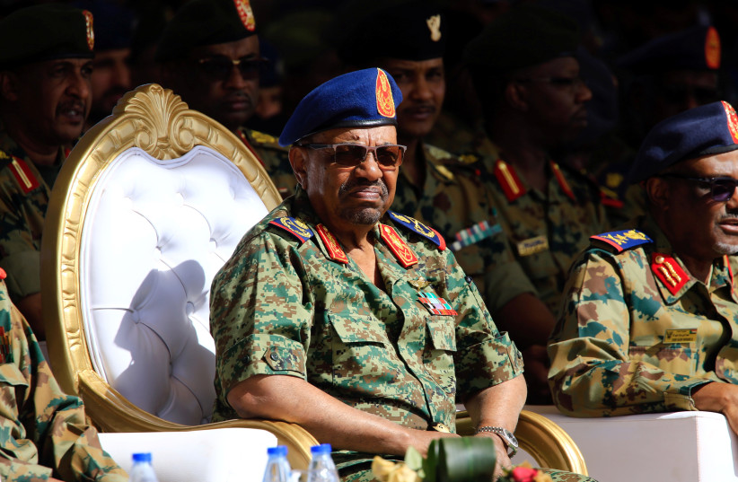Sudan's President Omar Ahmed al-Bashir looks on during Sudan's Saudi Air Force show during the final training exercise between the Saudi Air Force and Sudanese Air Forces at Merowe Airport in Merowe, Northern State, Sudan April 9, 2017. (photo credit: REUTERS/MOHAMED NURELDIN ABDALLAH)