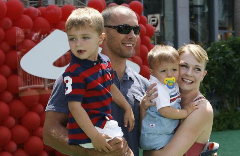 Actress Melissa Joan Hart and husband Mark pose with their sons Mason (L) and Braydon as they arrive at the premiere of the Disney-Pixar animated film "Up" in Hollywood, California May 16, 2009 (photo credit: FRED PROUSER/REUTERS)