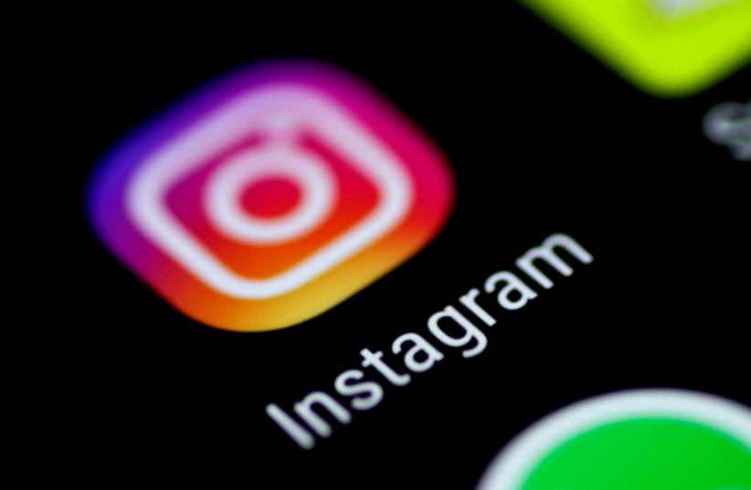 The Instagram application is seen on a phone screen August 3, 2017.  (photo credit: REUTERS/THOMAS WHITE)