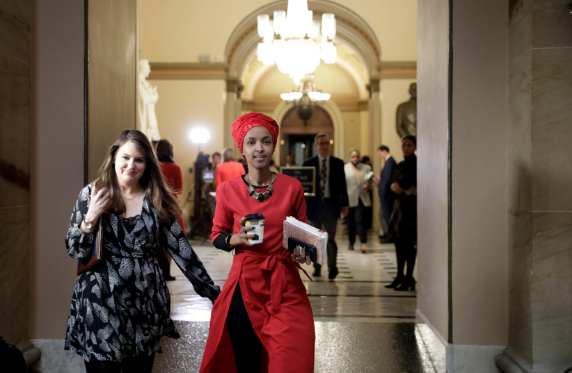 Rep. Ilhan Omar (D-MN) walks on Capitol Hill (photo credit: YURI GRIPAS/REUTERS)