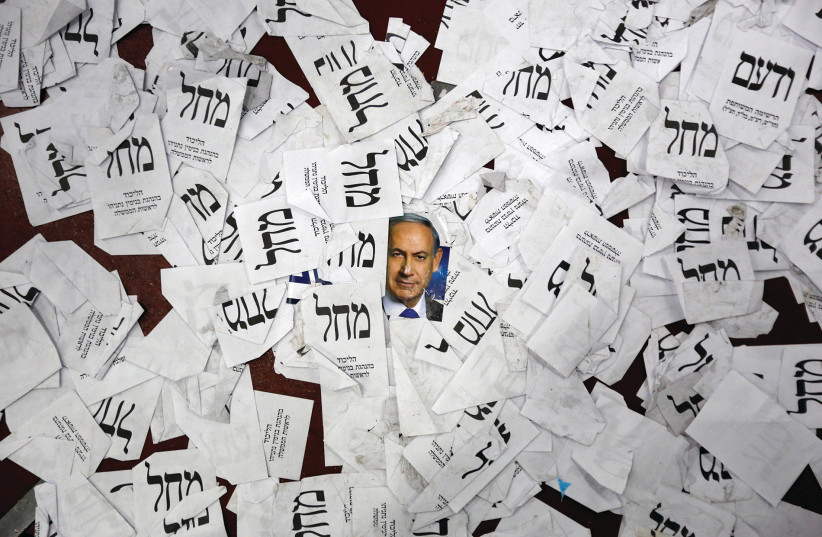 Election ballots from the 2015 vote lie on a floor (photo credit: REUTERS)
