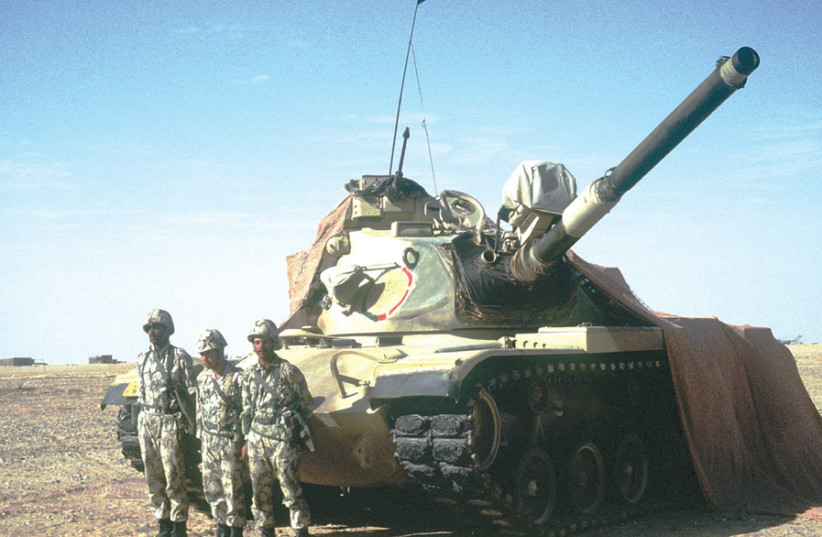 EGYPTIAN SOLDIERS stand in front of a 3rd Armored Brigade M-60 battle tank during the Gulf War in 1990. (photo credit: US AIR FORCE)