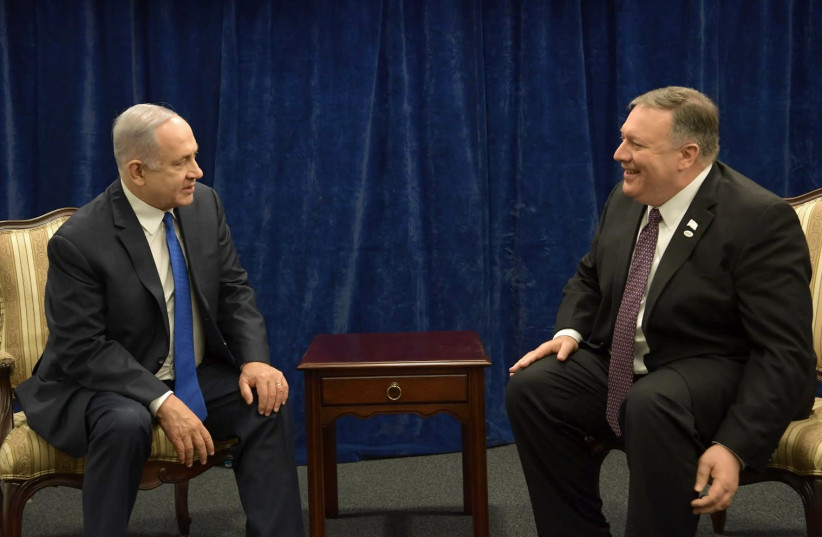 Prime Minister Benjamin Netanyahu meets with US Secretary of State Mike Pompeo at the Waraw Conference on February 14, 2019 (photo credit: AMOS BEN GERSHOM, GPO)