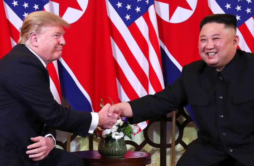 U.S. President Donald Trump and North Korean leader Kim Jong Un shake hands before their one-on-one chat during the second U.S.-North Korea summit at the Metropole Hotel in Hanoi, Vietnam February 27, 2019. (photo credit: LEAH MILLIS/REUTERS)