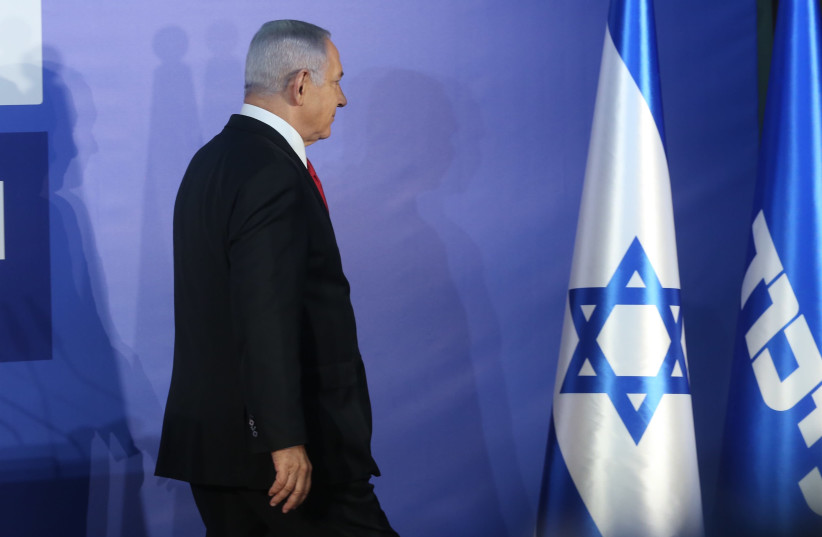 Prime Minister Benjamin Netanyahu walking after speaking against the alleged corruption charges against him (photo credit: MARC ISRAEL SELLEM)