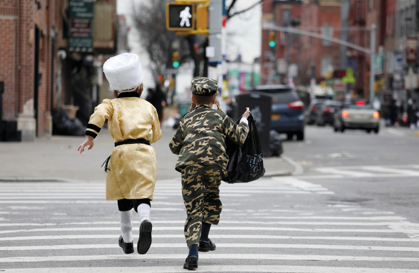 YOUTH DRESSED in Purim costumes (photo credit: REUTERS)