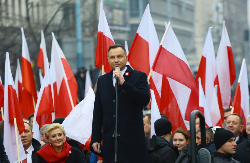 Poland's President Andrzej Duda delivers a speech before the official start of a march marking the 100th anniversary of Polish independence in Warsaw, Poland November 11, 2018. (photo credit: AGENCJA GAZETA/ADAM STEPIEN VIA REUTERS)