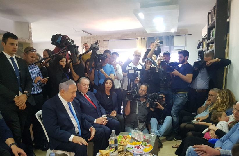 Prime Minister Benjamin Netanyhu (L) visits the shiva house of Rabbi Ahiad Ettinger, March 19th, 2019 (photo credit: TPS)
