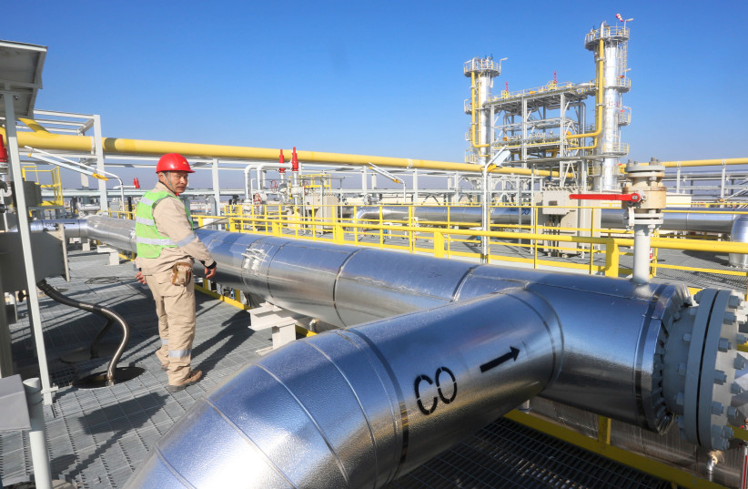 A worker is seen at the new CPF3 oil station in the Halfaya oilfield in southern of Maysan province, Halfaya, Iraq December 12, 2018 (photo credit: ESSAM AL-SUDANI/ REUTERS)