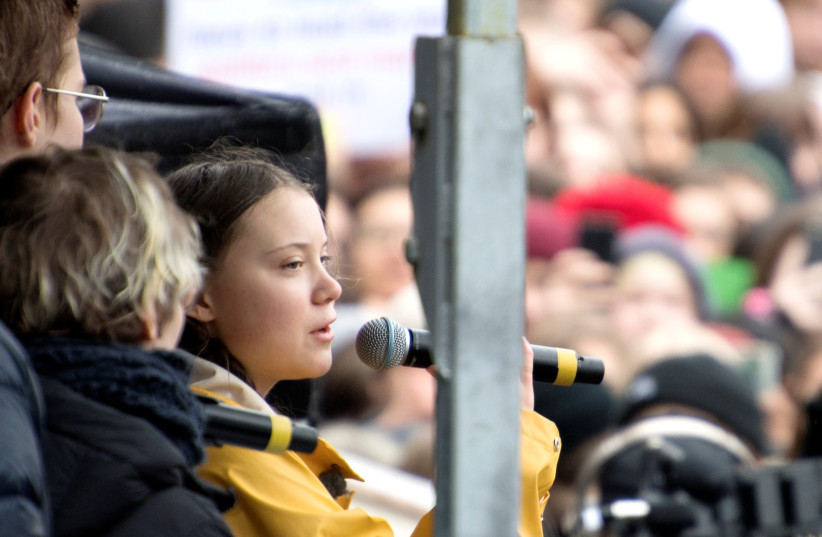 Activist Greta Thunberg speaks during the global demonstration "Global strike for future" in central Stockholm, Sweden, March 15, 2019. (photo credit: HENRIK MONTGOMERY / TT NEWS AGENCY VIA REUTERS)