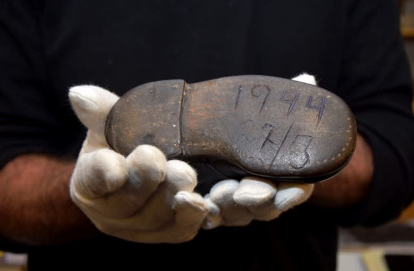 Photo of sole of Baby shoe belonging to Hinda Cohen engraved with the date of her deportation to Auschwitz (photo credit: YAD VASHEM)
