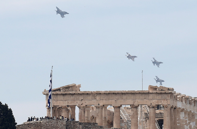 A formation of military fighting jets fly over the ancient Parthenon temple for a photo opportunity during the International Joint Medium Scale Air Force Exercise, in Athens, Greece April 4, 2017  (photo credit: REUTERS/ALKIS KONSTANTINIDIS)