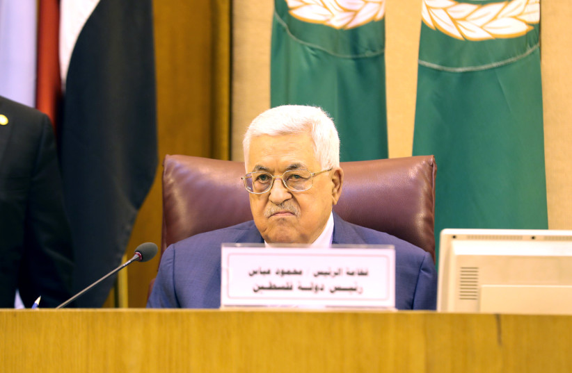 PA President Mahmoud Abbas attends the Arab League's foreign ministers meeting to discuss unannounced U.S. blueprint for Israeli-Palestinian peace, in Cairo, Egypt, April 21, 2019. (photo credit: MOHAMED ABD EL GHANY/REUTERS)