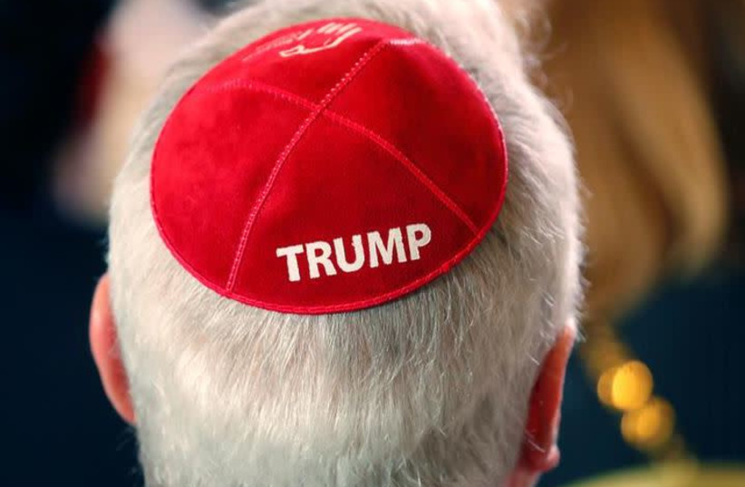 A man wears a Trump yarmulke while waiting for U.S. President Donald Trump to address the Republican Jewish Coalition 2019 Annual Leadership Meeting in Las Vegas, Nevada, U.S., April 6, 2019. (photo credit: KEVIN LAMARQUE/REUTERS)