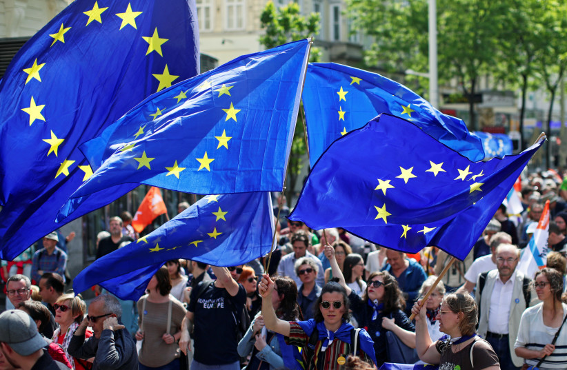 European Union flags flutter as people take part in the demonstration "One Europe for all", a rally against nationalism across the European Union, in Vienna, Austria, May 19, 2019. (photo credit: LISI NIESNER)