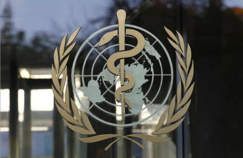 A logo is pictured on the World Health Organization (WHO) headquarters in Geneva, Switzerland.  (photo credit: REUTERS/ DENIS BALIBOUSE)